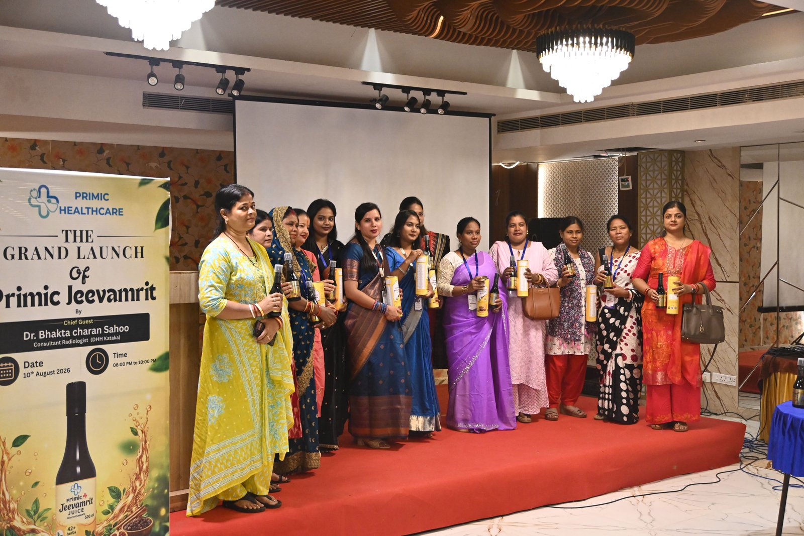 Women showcasing Primic Jeevamrit Juice at the grand launch event by Primic Healthcare